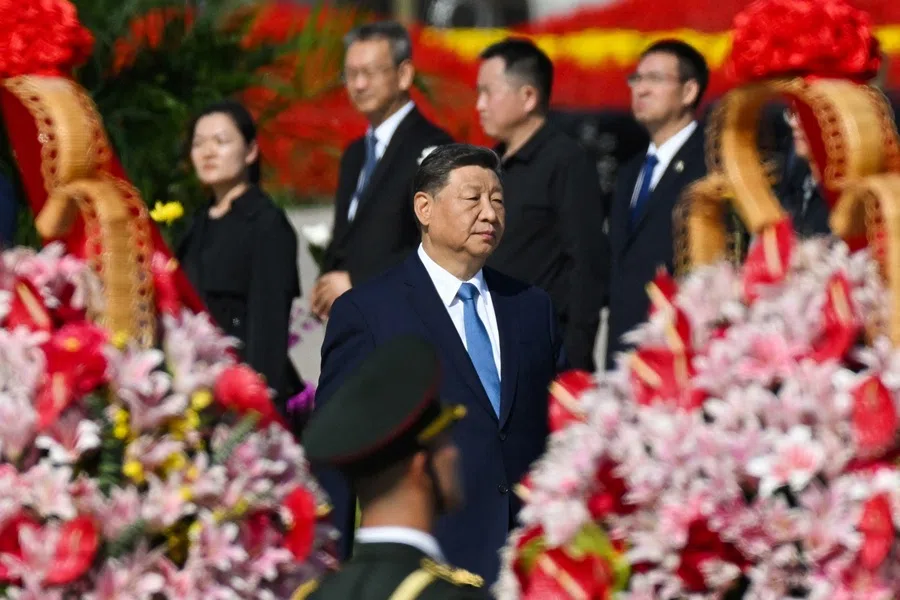 China’s President Xi Jinping walks past wreaths of flowers in Beijing’s Tiananmen Square on 30 September 2025.