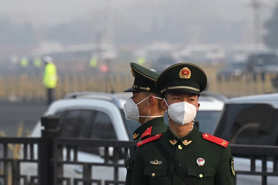 Paramilitary police officers stand guard south of the Great Hall of the People in Beijing, China, on 5 March 2023. (Greg Baker/AFP)