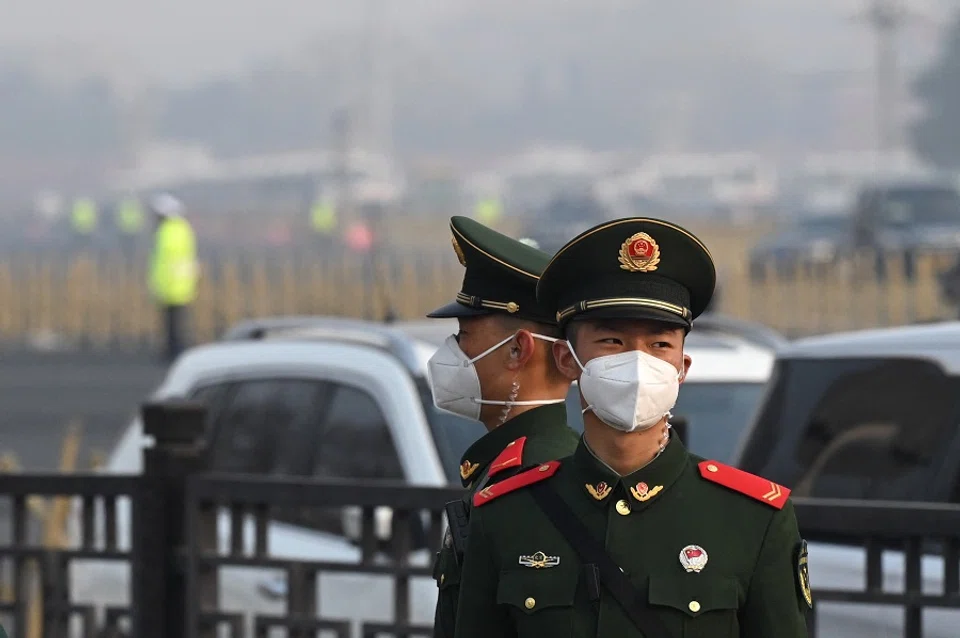 Paramilitary police officers stand guard south of the Great Hall of the People in Beijing, China, on 5 March 2023. (Greg Baker/AFP)