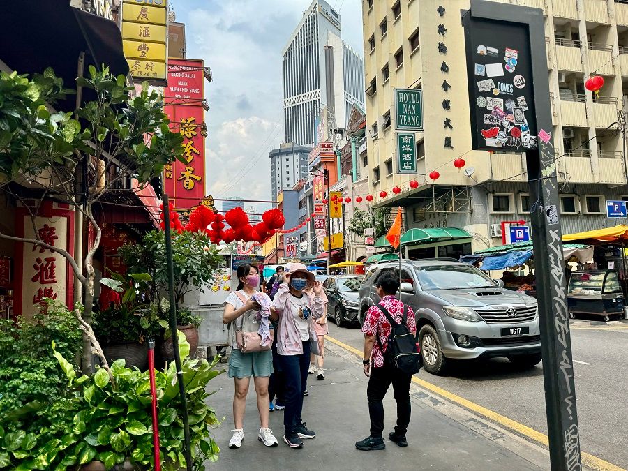 More Chinese tourists are visiting Malaysia, such as Petaling Street Market in Kuala Lumpur, after Malaysia and China granted visa-free entry to each other's citizens.