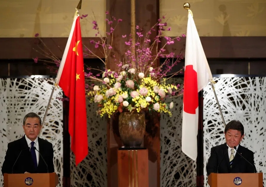 China's State Councilor and Foreign Minister Wang Yi (left) and his Japanese counterpart Toshimitsu Motegi attend their joint news conference after their meeting in Tokyo on 24 November 2020. (Photo by ISSEI KATO / POOL / AFP)