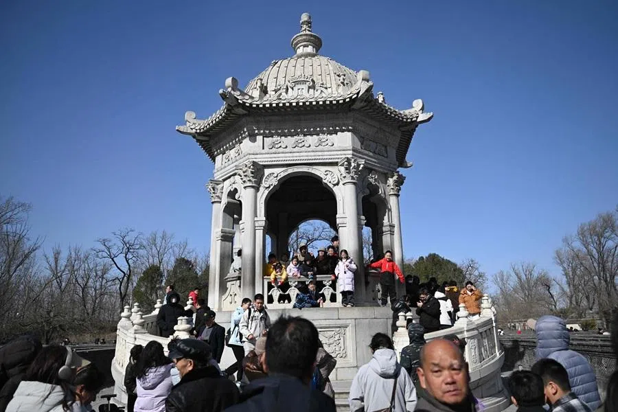 People visit the Old Summer Palace at Yuanmingyuan Park on 22 February 2026. (Pedro Pardo/AFP)