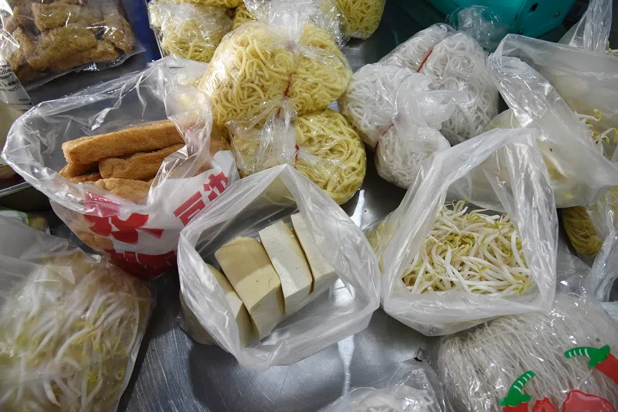 Apart from tau kwa, Tan Geok Seng also sells bean sprouts and noodles to supplement his income.