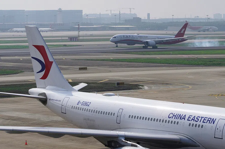 A China Eastern Airlines aircraft and a Shanghai Airlines aircraft are seen in Hongqiao International Airport in Shanghai, China, 4 June 2020. (Aly Song/File Photo/Reuters)
