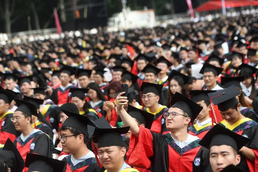 Graduates of Wuhan University attend the graduation ceremony in Wuhan, Hubei province, China, on 20 June 2023. (AFP)