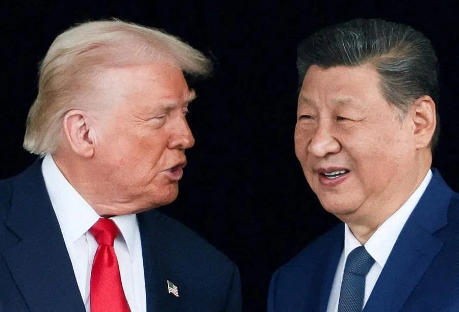US President Donald Trump and Chinese President Xi Jinping talk as they leave after a bilateral meeting at Gimhae International Airport, on the sidelines of the Asia-Pacific Economic Cooperation (APEC) summit, in Busan, South Korea, on 30 October 2025. (Evelyn Hockstein/Reuters)