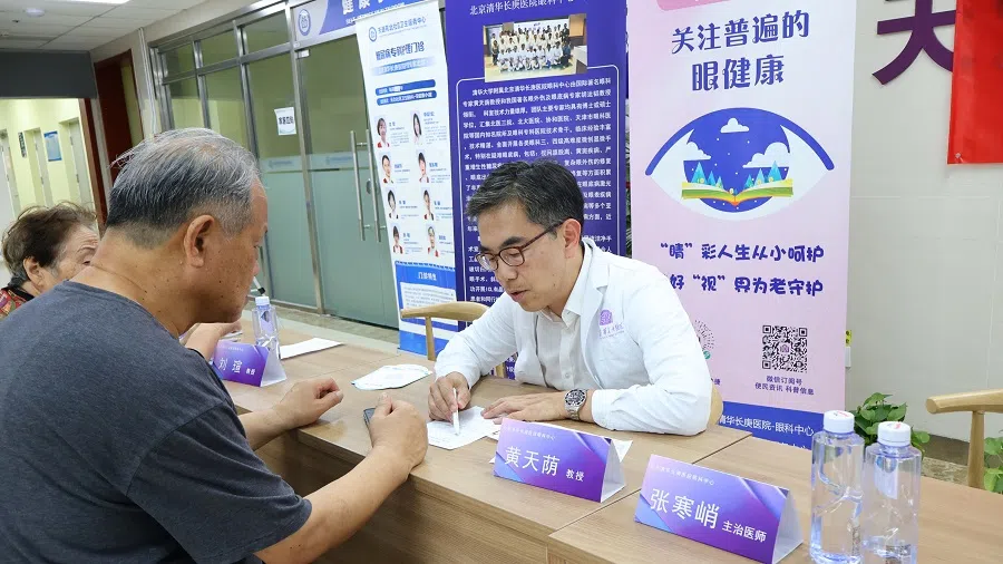 Wong with a patient.