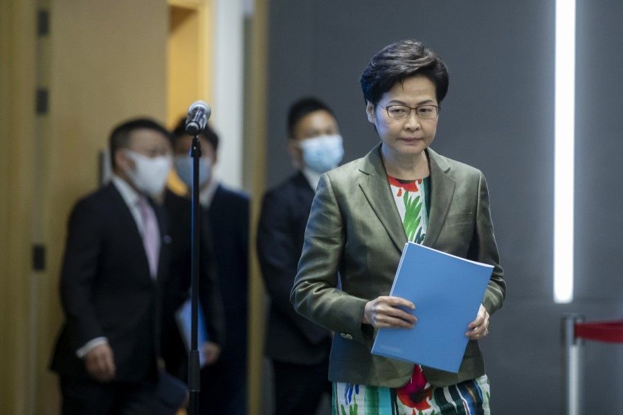 Carrie Lam, Hong Kong's chief executive, arrives for a news conference in Hong Kong, China, on 6 October 2021. In the last annual policy address of her current term, Lam announced plans to transform the northern part of the New Territories. (Paul Yeung/Bloomberg)