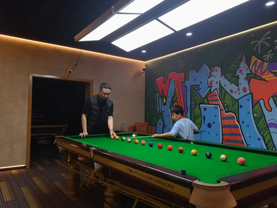 Zhang Jiahao (right) trains with his coach. (Yush Chau/SPH Media)