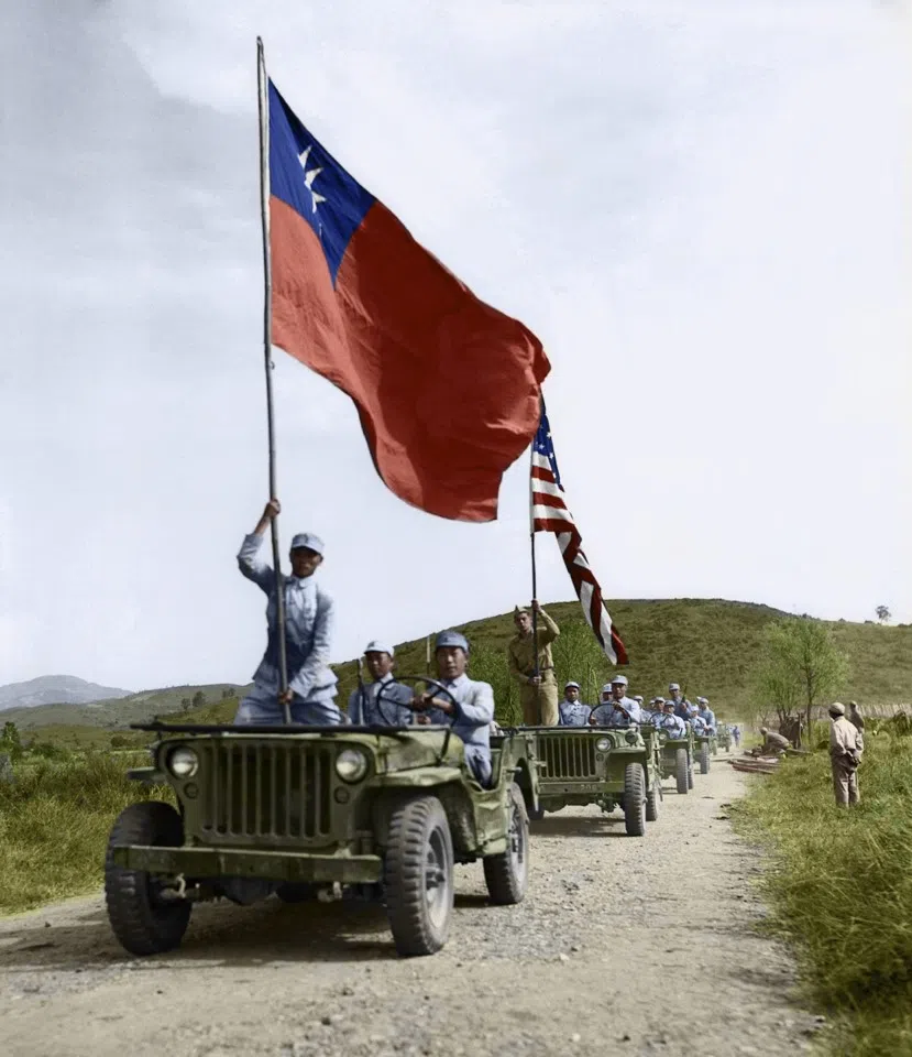 November 1944, Lungling, Yunnan - After the Chinese Expeditionary Y-Force drove the Japanese out of the occupied Lungling, American and Chinese soldiers, guided by their flags, moved into the ancient city in Yunnan Province. The joint forces achieved victory in the campaign along the Salween River, which is named Nu River in China, thus reopening the Yunnan-Burma Highway.