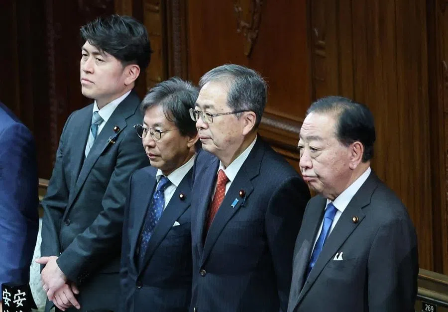 Co-leaders of the opposition party Centrist Reform Alliance, Yoshihiko Noda (right) and Tetsuo Saito (second right) reacts as the dissolution of the House of Representatives is announced during the plenary session at the Diet in Tokyo on 23 January 2026. (JIJI Press/AFP)