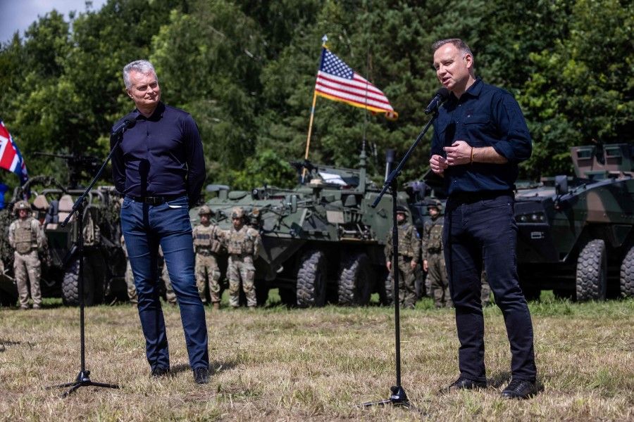 Lithuanian President Gitanas Nauseda (left) and Polish President Andrzej Duda (right) hold a joint press conference following a joint visit of the NATO Multinational Division North East mobile command centre near Szypliszki village in north-eastern Poland, on 7 July 2022. (Wojtek Radwanski/AFP)