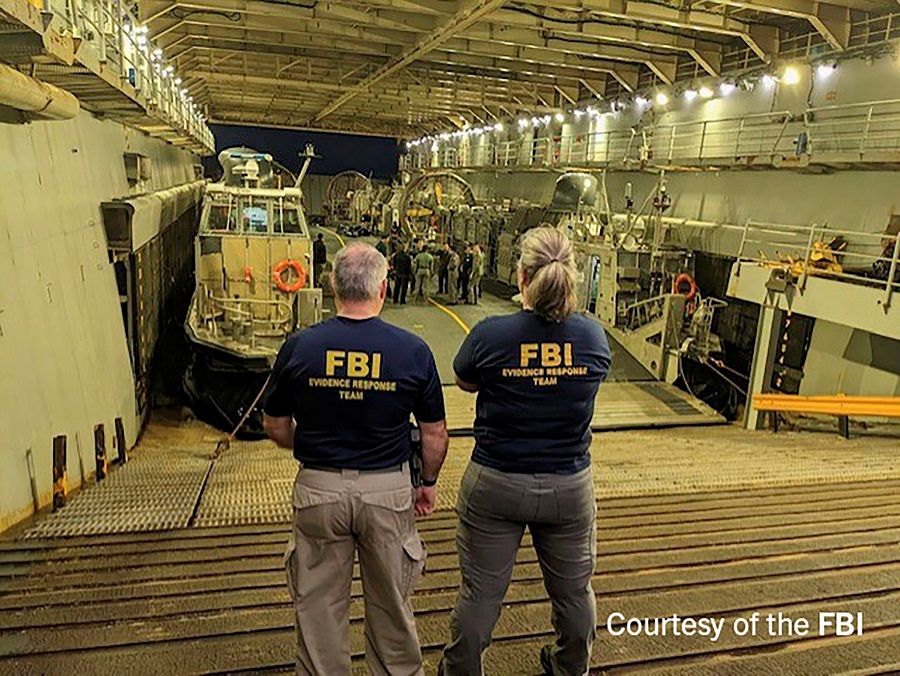 FBI Special Agents ready to process material recovered from the Chinese balloon that was shot down by the US military jet off the coast of South Carolina, in an image released by the FBI in Washington, US, 9 February 2023. (FBI/Handout via Reuters)