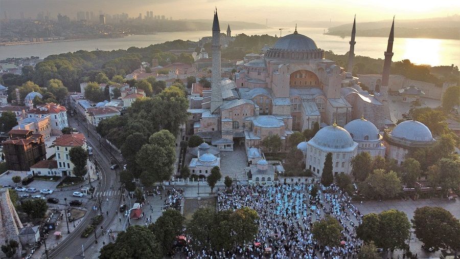 People pray on the first day of Muslim holiday of Eid al-Adha outside the Hagia Sophia Grand Mosque in Istanbul, Turkey, 9 July 2022. (Murad Sezer/Reuters)