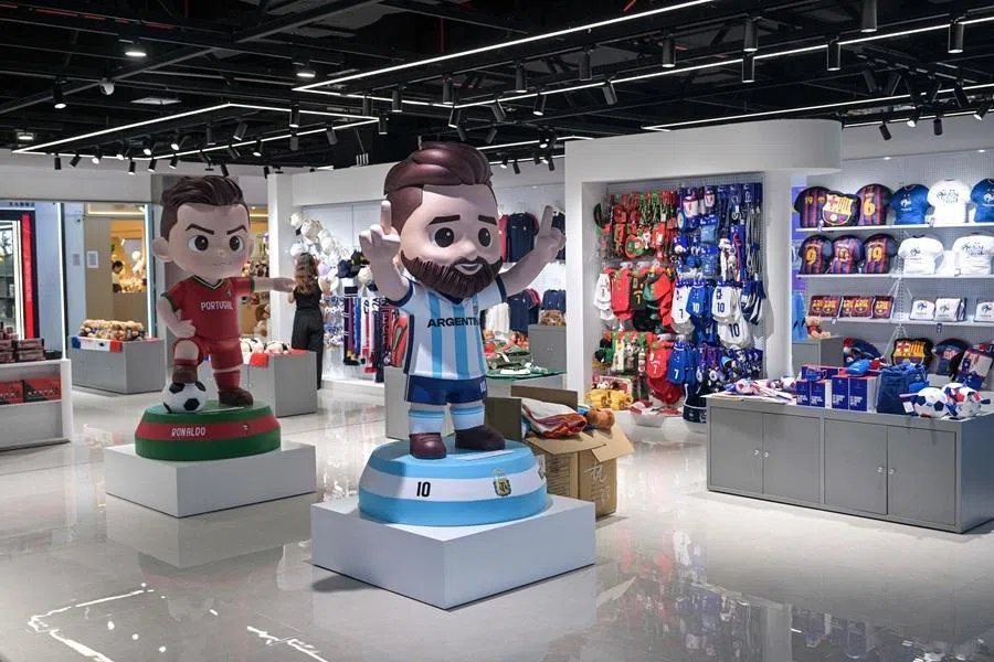 This photo taken on 5 June 2026 shows merchandise of football teams that will participate in the FIFA World Cup 2026 at a shop in Yiwu in eastern China's Zhejiang province.