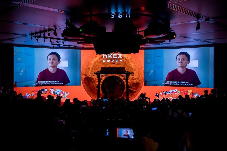 Jack Ma, former chairman of Alibaba Group Holding Ltd., is displayed on screens during the company's listing ceremony at the Hong Kong Stock Exchange. (Paul Yeung/Bloomberg)
