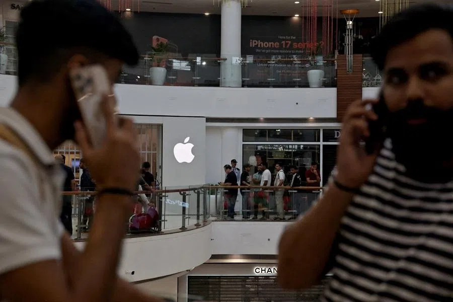 People wait in a queue outside an Apple retail store, as the iPhone 17 series goes on sale in New Delhi, India, 19 September 2025.