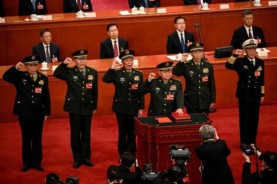 Zhang Youxia (front), newly-elected vice-chairman of the Central Military Commission of the People's Republic of China, swears an oath with members of the Central Military Commission (left to right) Zhang Shengmin, Liu Zhenli, He Weidong, Li Shangfu and Miao Hua, after they were elected during the fourth plenary session of the National People's Congress (NPC) at the Great Hall of the People in Beijing, China, on 11 March 2023.