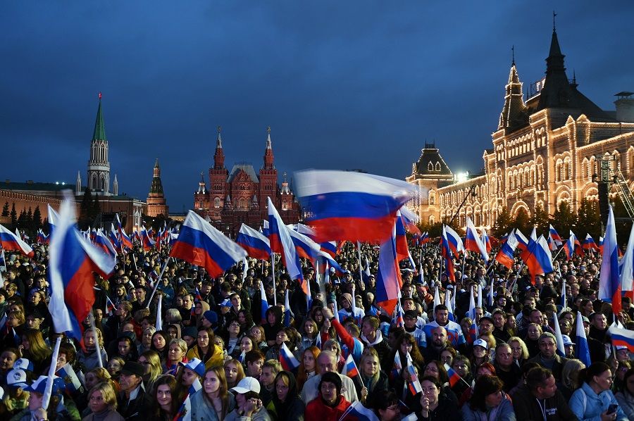 People attend a concert marking the declared annexation of the Russian-controlled territories of four Ukrainian regions: Donetsk, Luhansk, Kherson and Zaporizhzhia, in Red Square in central Moscow, Russia, 30 September 2022. (Sputnik/Maksim Blinov/Pool via Reuters)