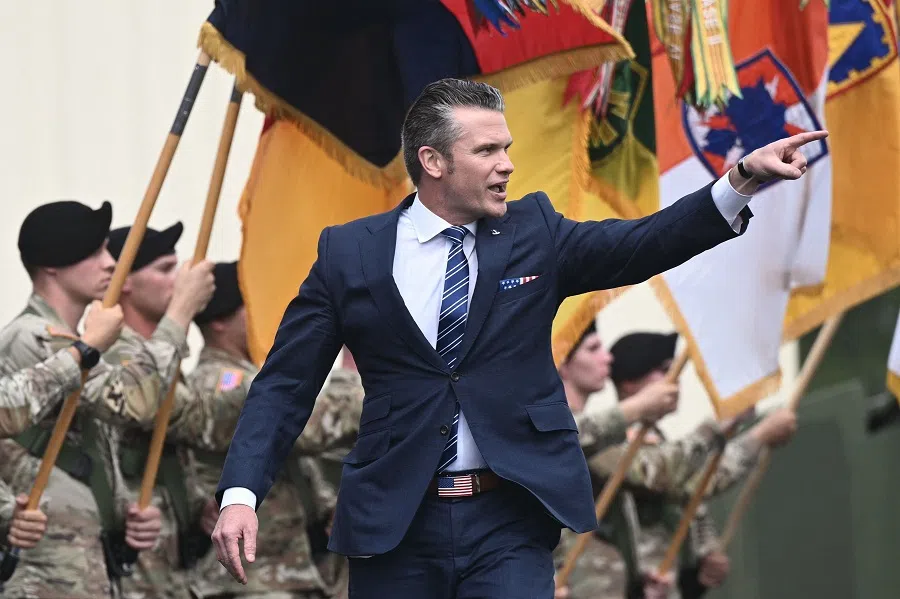 US Defence Secretary Pete Hegseth points as he arrives to introduce the US president at Fort Bragg, a US Army military installation, near Fayetteville, North Carolina, on 10 June 2025. (Brendan Smialowski/AFP)