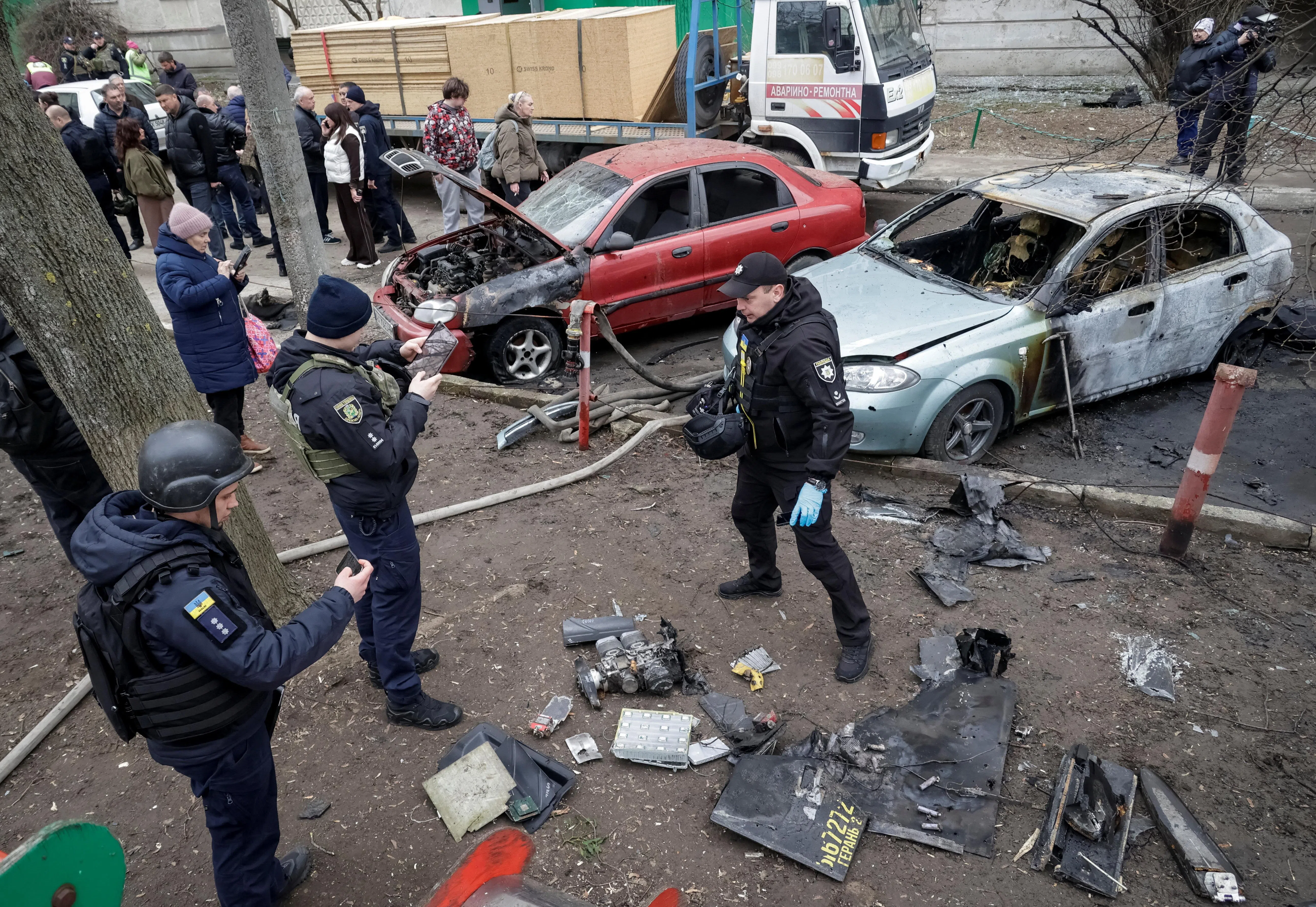 Police experts work at the site of a Russian drone strike, amid Russia's attack on Ukraine, in Kharkiv, Ukraine, on 25 March 2026. (Sofiia Gatilova/Reuters)