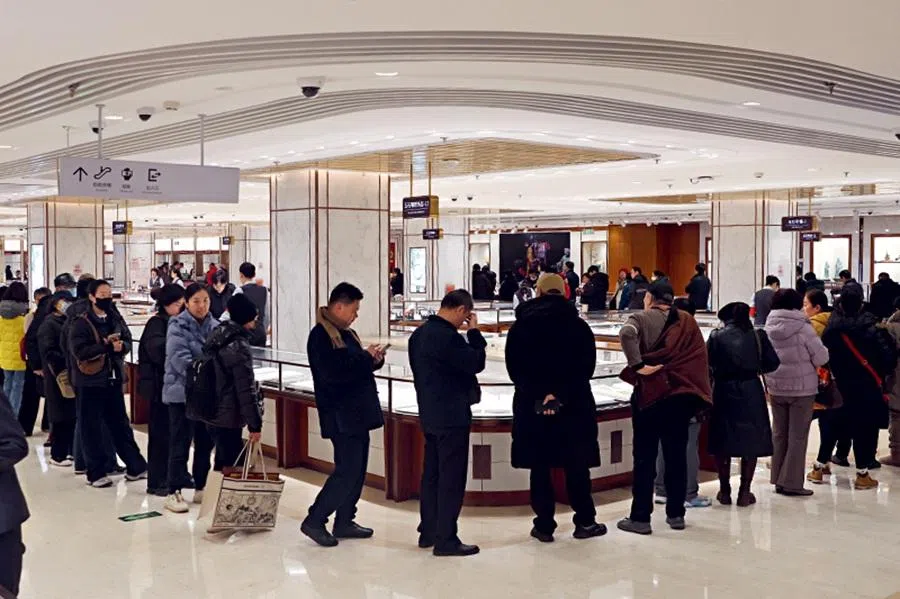 Customers queue for gold buyback services at Beijing Caishikou Department Store on 3 February 2026. (Wang Xinyu/Caixin)