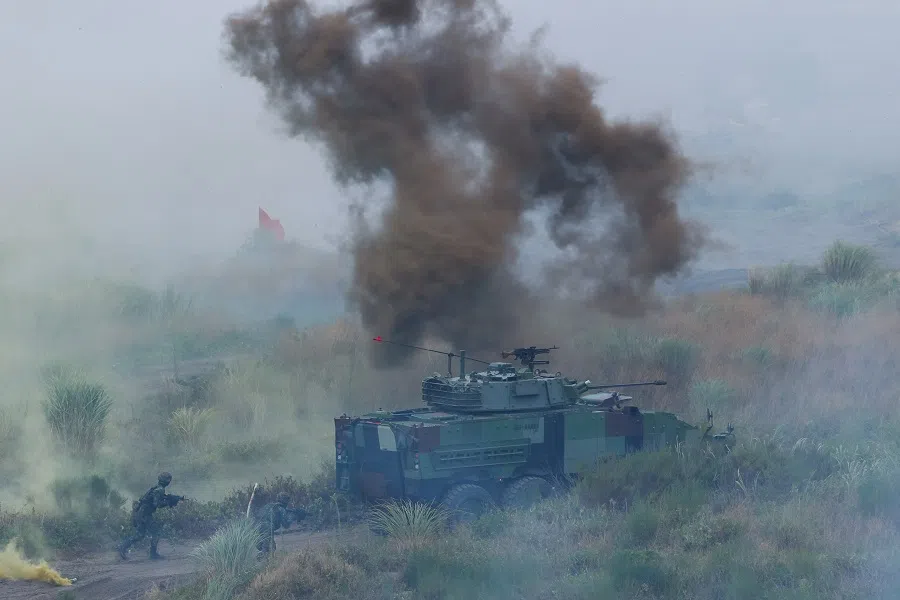 Taiwanese soldiers run during the annual Han Kuang anti-landing drill in New Taipei City, Taiwan, 27 July 2023. (Ann Wang/Reuters)