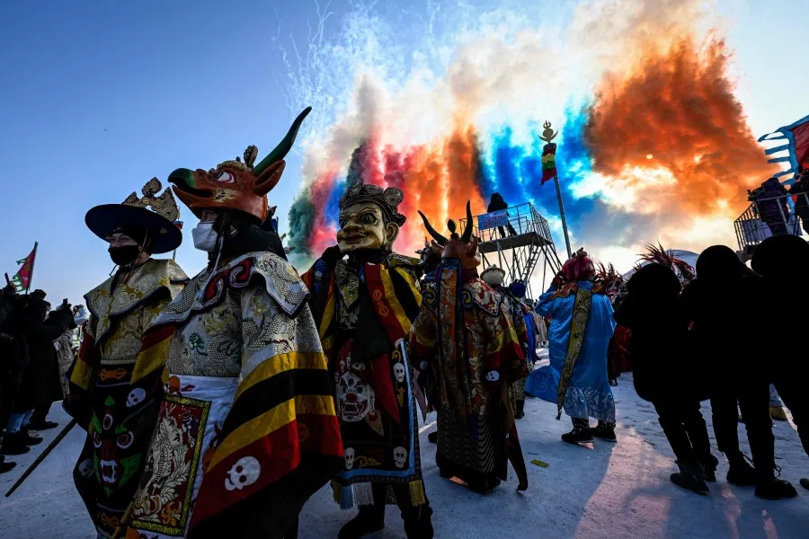 Folk performers take part in the opening ceremony of the annual Chagan Lake Winter Fishing Festival in Songyuan, in northeast China's Jilin province on 28 December 2022. (Jade Gao/AFP)