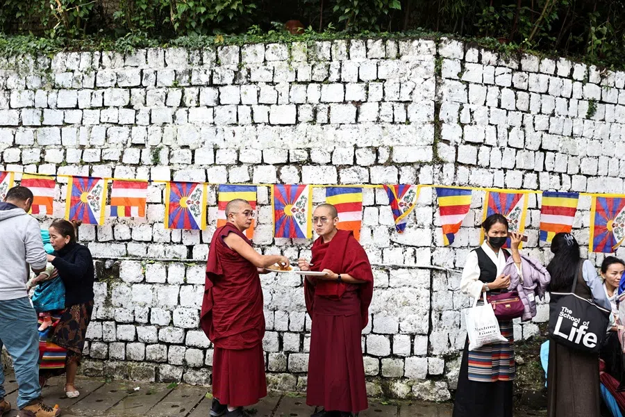 Monks have a meal outside of the temple complex, on the day of the 90th birthday of Tibetan spiritual leader, the 14th Dalai Lama, at the Tsuglakhang, also known as the Dalai Lama Temple complex, in the northern town of Dharamshala, India, on 6 July 2025. (Reuters/Stringer)