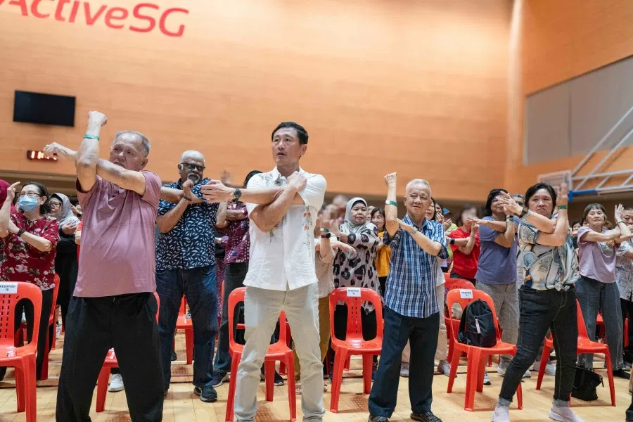 Singapore’s Health Minister Ong Ye Kung (centre, in white) at the launch of OCBC SeniorCare. (SPH Media)