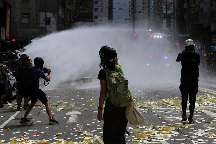 Riot police use water cannon to disperse anti-national security law protesters. (Tyrone Siu/Reuters)