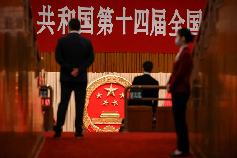 Security officers stand guard inside the Great Hall of the People ahead of the fourth plenary session of the National People's Congress (NPC) in Beijing, China, on 11 March 2023. (Greg Baker/Pool via Reuters/File Photo)