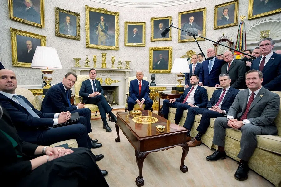 US President Donald Trump (centre right_, and NATO secretary general Mark Rutte (centre left), during a meeting in the Oval Office of the White House in Washington, DC, US, on 13 March 2025. (Yuri Gripas/Bloomberg)