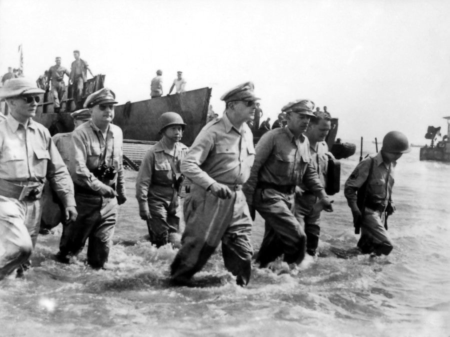 General Douglas MacArthur wades ashore during initial landings at Leyte, Philippine Islands, 1944. (Wikimedia)