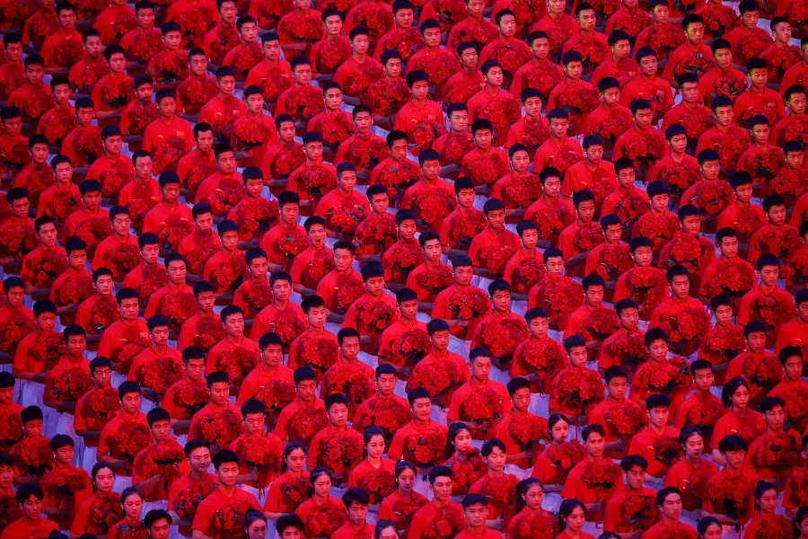 Performers take part in a show commemorating the 100th anniversary of the founding of the Communist Party of China at the National Stadium in Beijing, China, 28 June 2021. (Thomas Peter/Reuters)