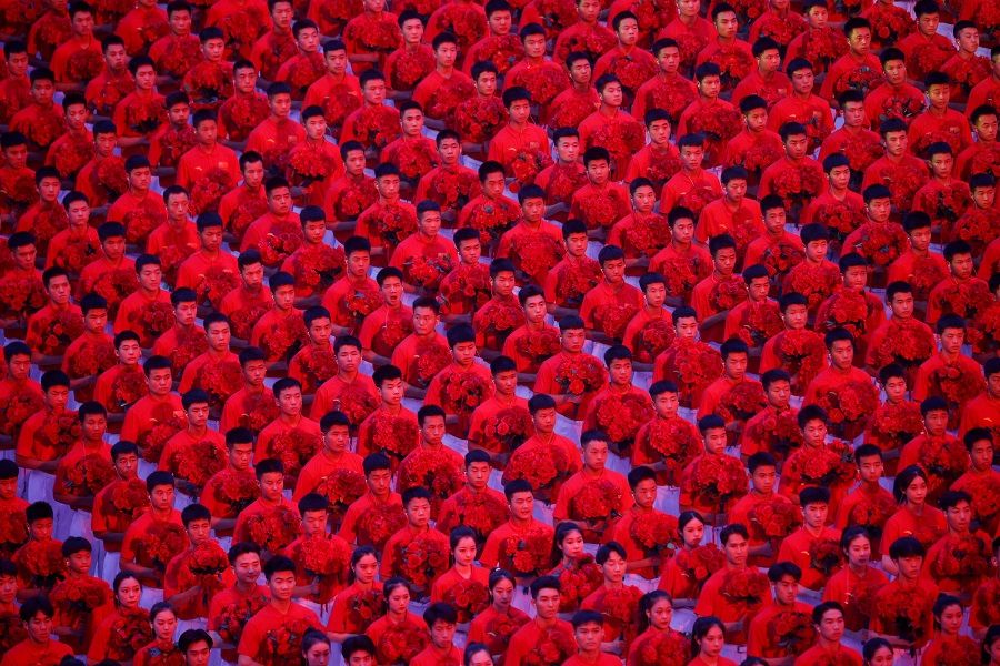 Performers take part in a show commemorating the 100th anniversary of the founding of the Communist Party of China at the National Stadium in Beijing, China, 28 June 2021. (Thomas Peter/Reuters)