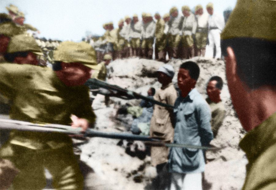The Nanjing Massacre, 1937. Japanese soldiers stab Chinese POWs with bayonets, and order new recruits to practice bayoneting the Chinese. This photo was taken by a Japanese army doctor and released only after the war. The horrific scene shocked the international community.