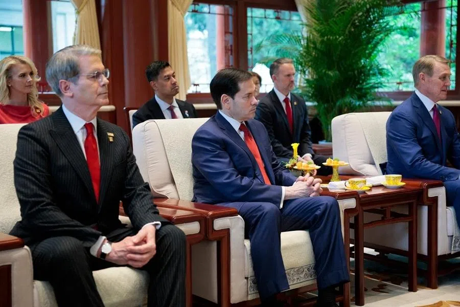 US Treasury Secretary Scott Bessent (left) and US Secretary of State Marco Rubio (centre) look on as US President Donald Trump meets with China’s President Xi Jinping on the sidelines of their visit to Zhongnanhai Garden in Beijing on 15 May 2026. (Evan Vucci/AFP)
