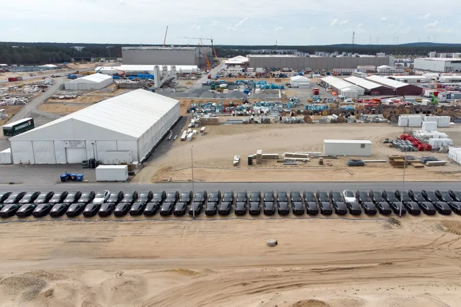 Tesla Model Y electric vehicles line a road at the Tesla Inc. Gigafactory in Gruenheide, Germany, on 11 June 2022. (Photographer: Liesa Johannssen-Koppitz/Bloomberg)
