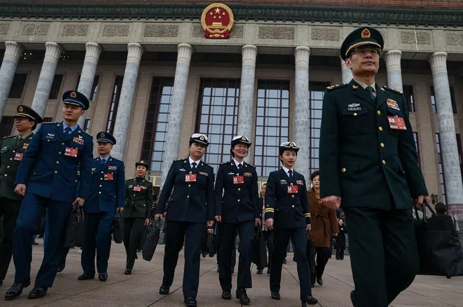 Military delegates from the Chinese People's Liberation Army (PLA) leave the Great Hall of the People following the opening session of the National People's Congress in Beijing, China, on 5 March 2026.