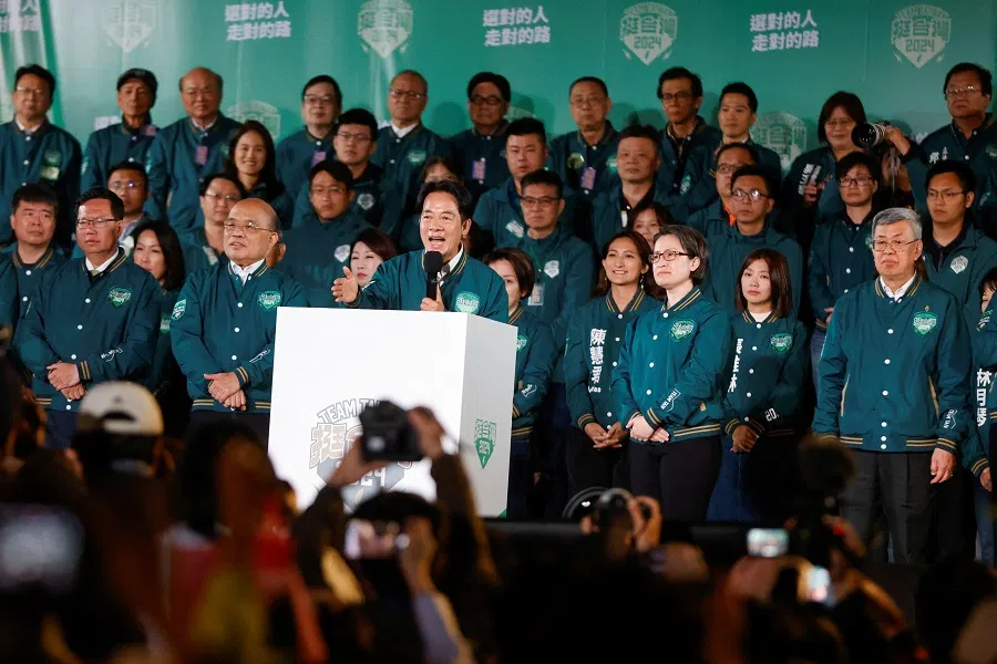 Taiwan President-elect Lai Ching-te speaks on stage at a rally, flanked by his running mate Hsiao Bi-khim, following the victory in the presidential elections, in Taipei, Taiwan, on 13 January 2024. (Carlos Garcia Rawlins/Reuters)