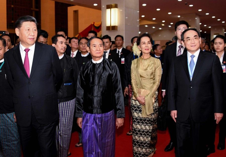 This handout picture released by Myanmar News Agency (MNA) shows Chinese President Xi Jinping (L), Myanmar President Win Myint (2nd L) and Myanmar State Counsellor Aung San Suu Kyi (2nd R), attending a ceremony marking Myanmar and China's 70th anniversary of diplomatic relations in Naypyidaw, January 2020. (Handout/AFP)