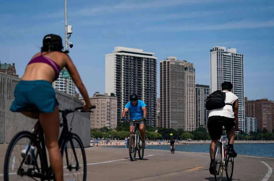 Cyclists on Lakefront Trail along Lake Michigan in Chicago, Illinois, US, 14 August 2024.