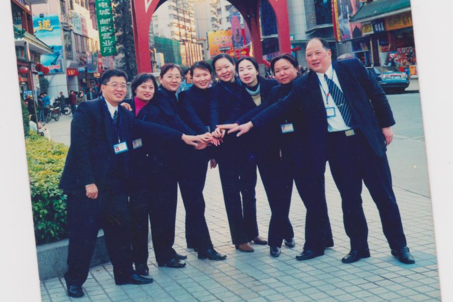 Huang Juan (third from the right) in a group photo with her colleagues from the China Construction Bank. (Photo: Huang Juan)