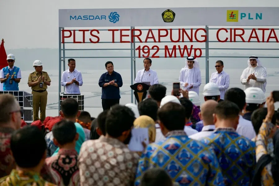 Indonesian President Joko Widodo (centre) delivers a speech accompanied by Minister of State Owned Enterprises Erick Thohir (fourth from left) during the inauguration of a newly built floating solar power plant at Cirata Reservoir, West Java, on 9 November 2023. (Bay Ismoyo/AFP)