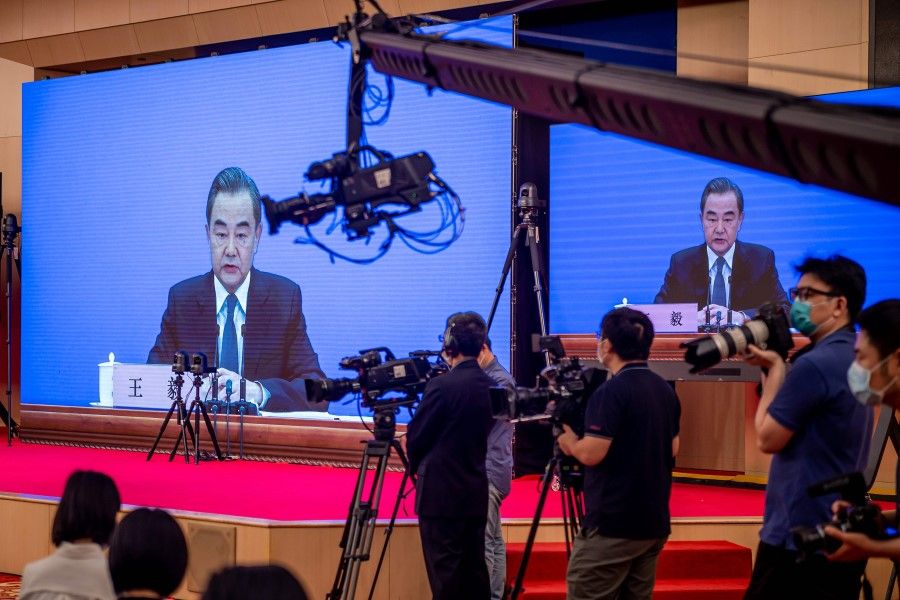 China's Foreign Minister Wang Yi speaks during his online video link press conference during the National People's Congress (NPC) at the media centre in Beijing on 24 May 2020. (Nicolas Asfouri/ AFP)