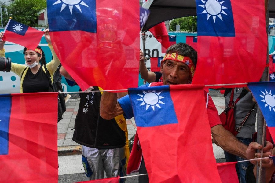 Supporters of the Kuomintang (KMT) rally outside the KMT headquarters in Taipei on 17 May 2023. (Sam Yeh/AFP)