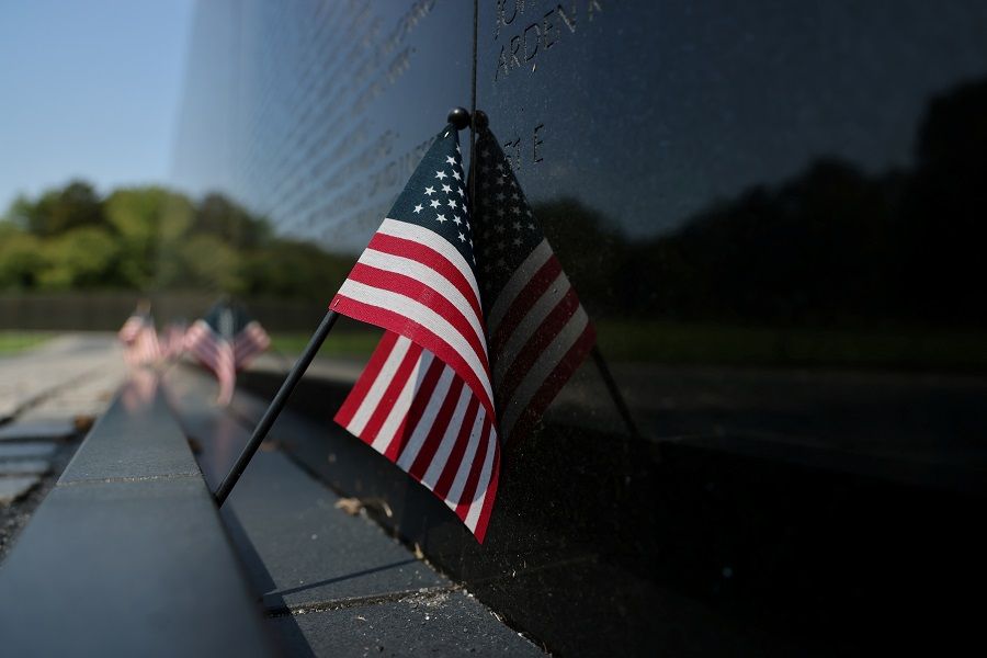 A small US flag is left at the Vietnam Veterans Memorial in Washington, US, 4 September 2020. (Jonathan Ernst/Reuters)