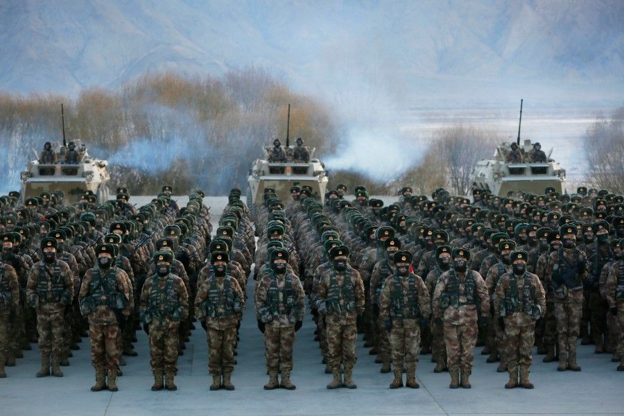 This photo taken on 4 January 2021 shows Chinese People's Liberation Army (PLA) soldiers assembling during military training at Pamir Mountains in Kashgar, northwestern China's Xinjiang region. (STR/AFP)