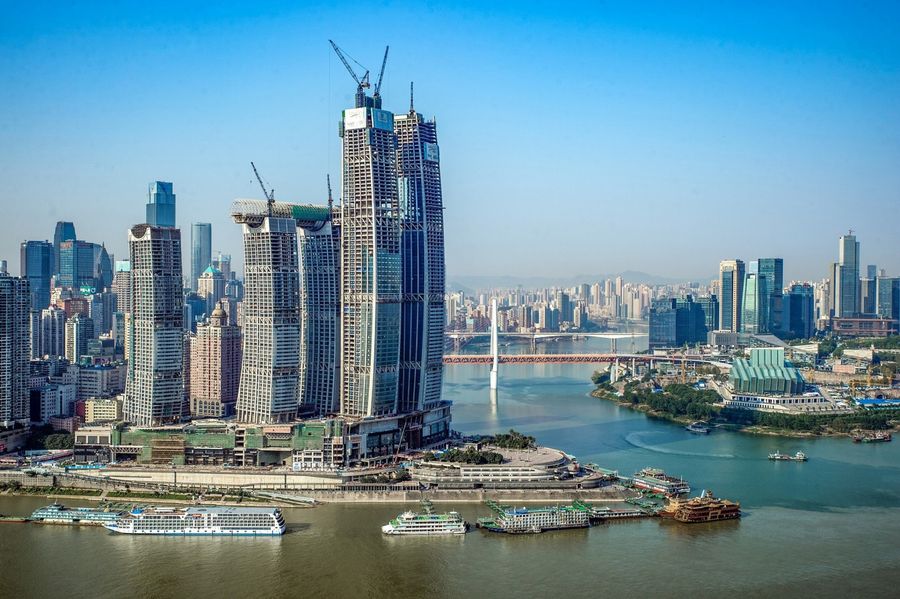 Inspired by the region's thousand years of waterway transportation culture, Raffles City Chongqing's award-winning design takes the form of powerful sail surging forward on the historic Chaotianmen site where Yangtze and Jialing rivers meet. The photo shows a side profile of Raffles City Chongqing. (CapitaLand)